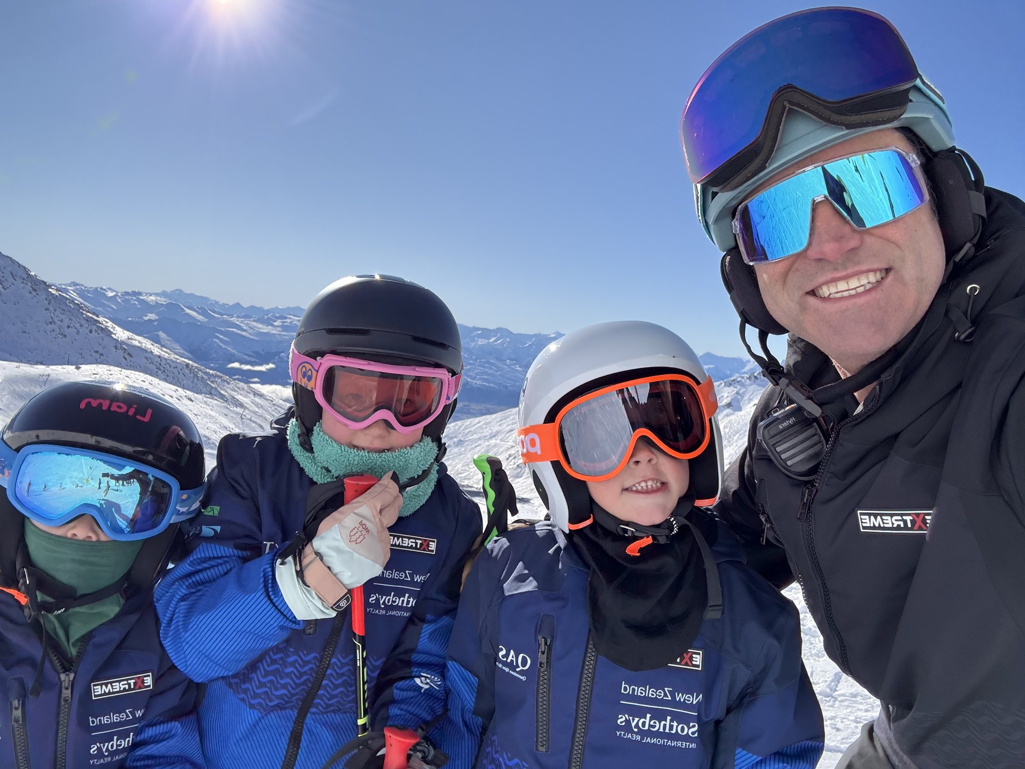 Ash Johns with young skiers in Queenstown